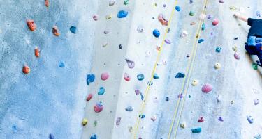 a man climbing a rock wall