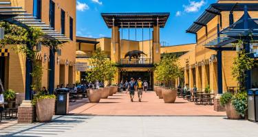 A courtyard on the Irvine campus with students walking into and out of buildings