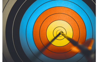 Dart hitting target bullseye