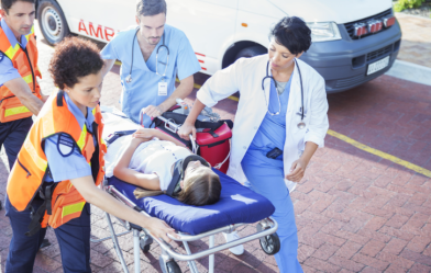 Emergency first responders rush patient to medical care