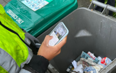 Person using Zabble AI to assess waste in container