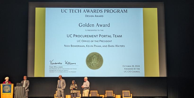 Renea Davis-Leathers accepts UC Tech Golden Award at UC Tech event on October 29, 2024