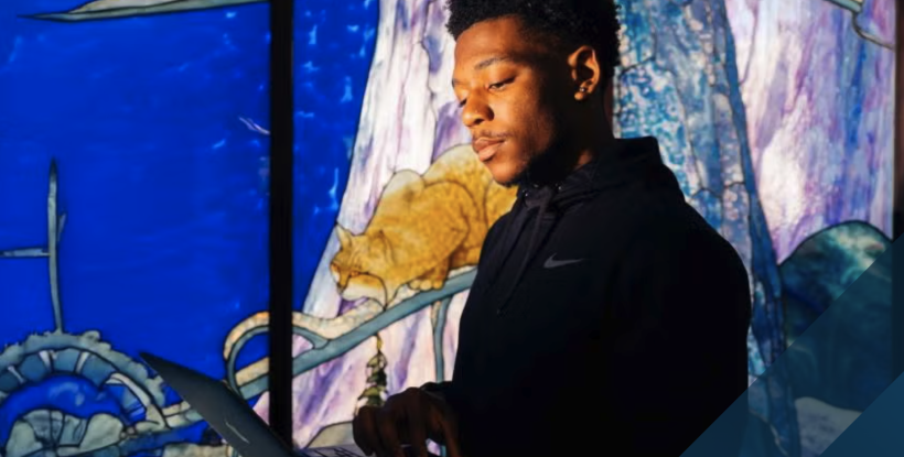 Man looking at a laptop screen with colorful background
