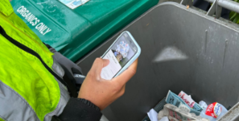 Person using Zabble AI to assess waste in container
