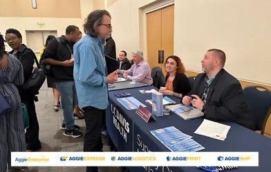 supplier in front of a booth at a convention