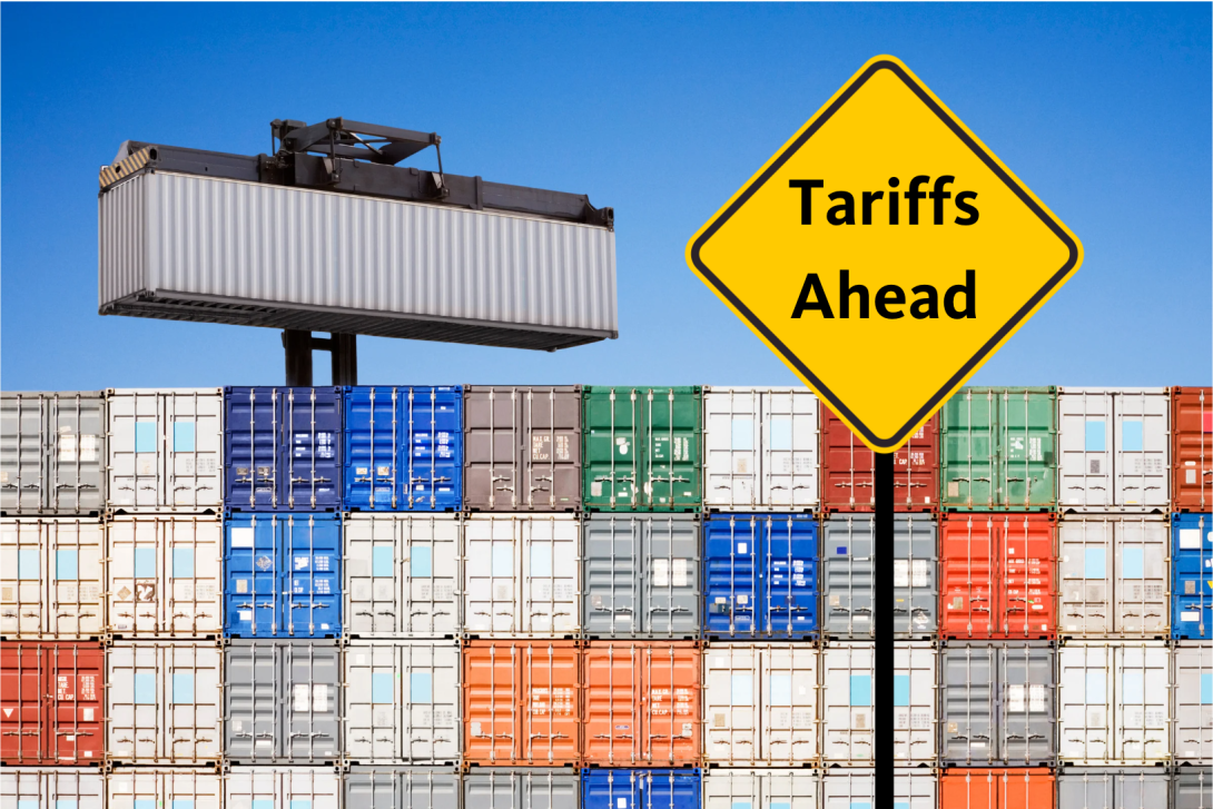 Container ships in port with Tariffs Ahead sign