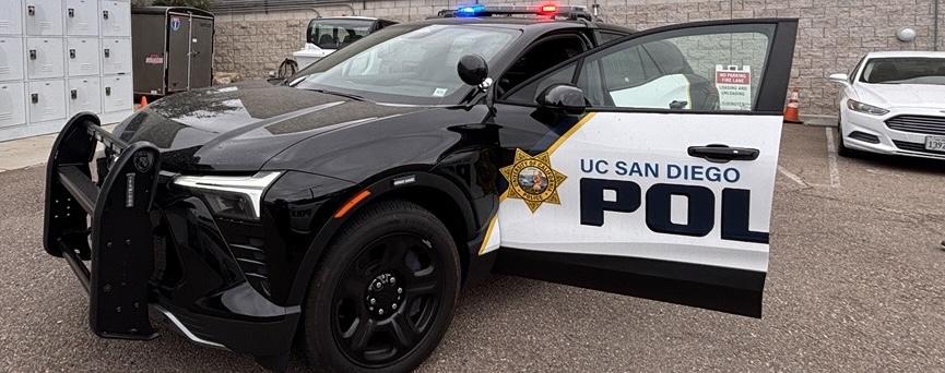 an electric police car with the driver side door open