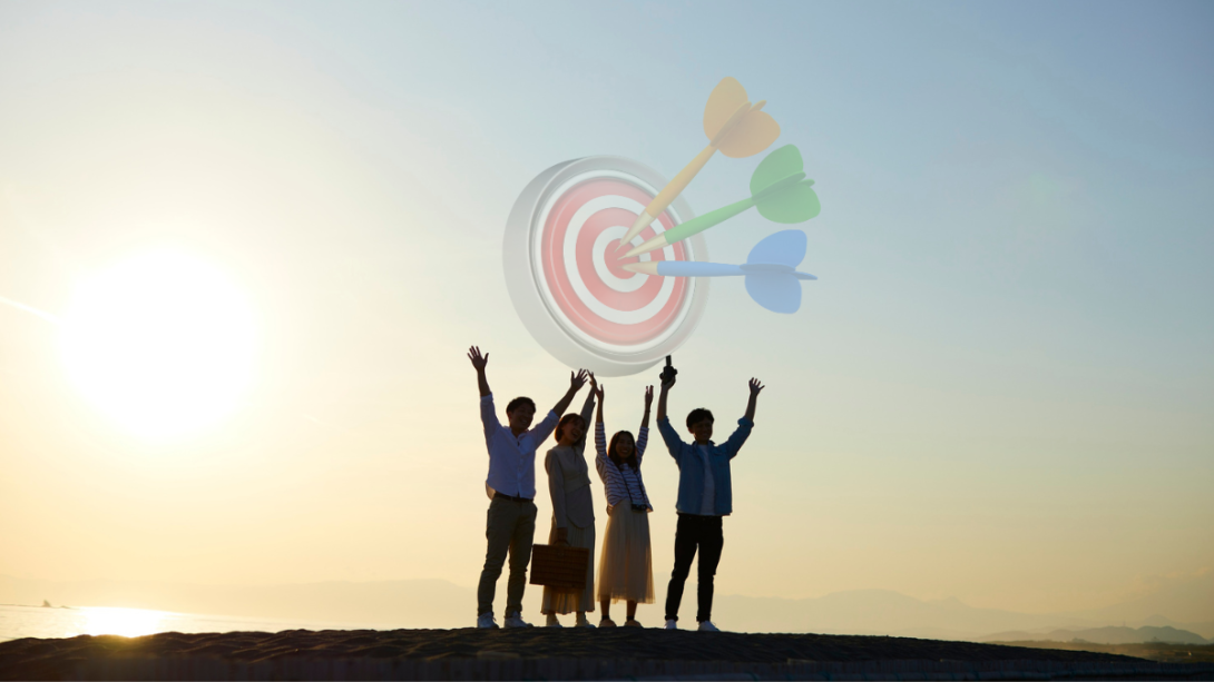 People celebrating surpassing a targeted goal